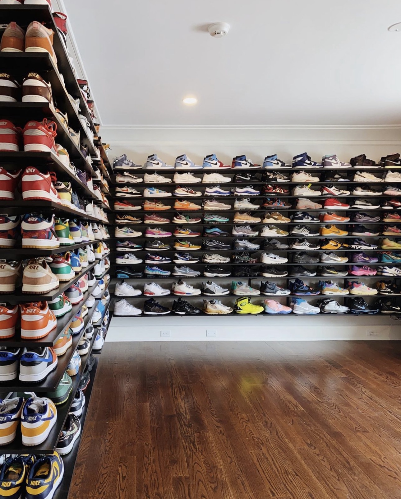 Organized wall of shoes presented on display shelves